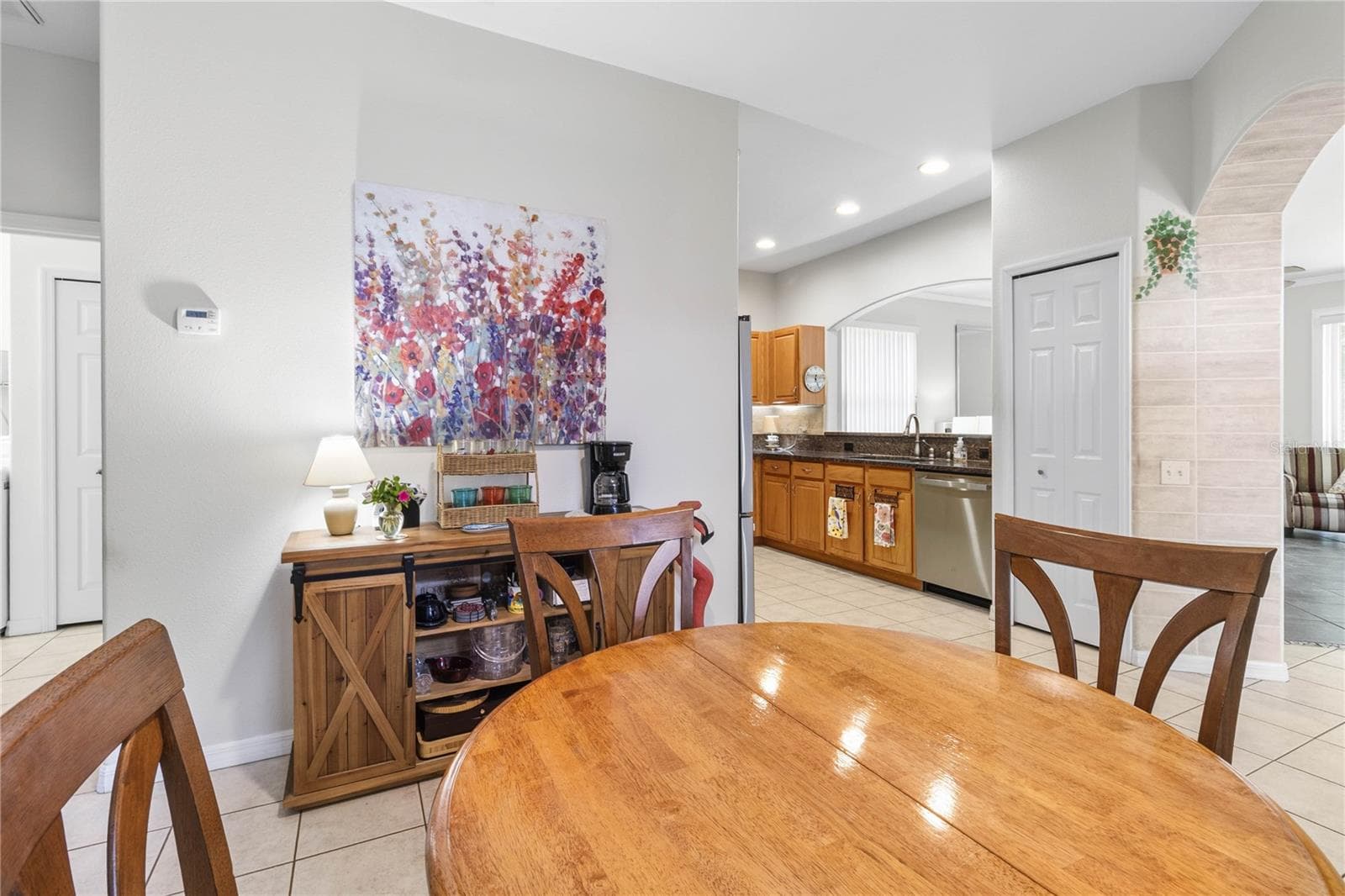 Dining and view of kitchen - 3007 BELLFLOWER WAY, LAKELAND