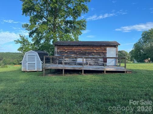 12' x 24' shed with finished interior, two ceiling fans w/lights, its own breaker box for power, front deck and smaller shed for additional storage - 1211 Sharon School Road, Stony Point