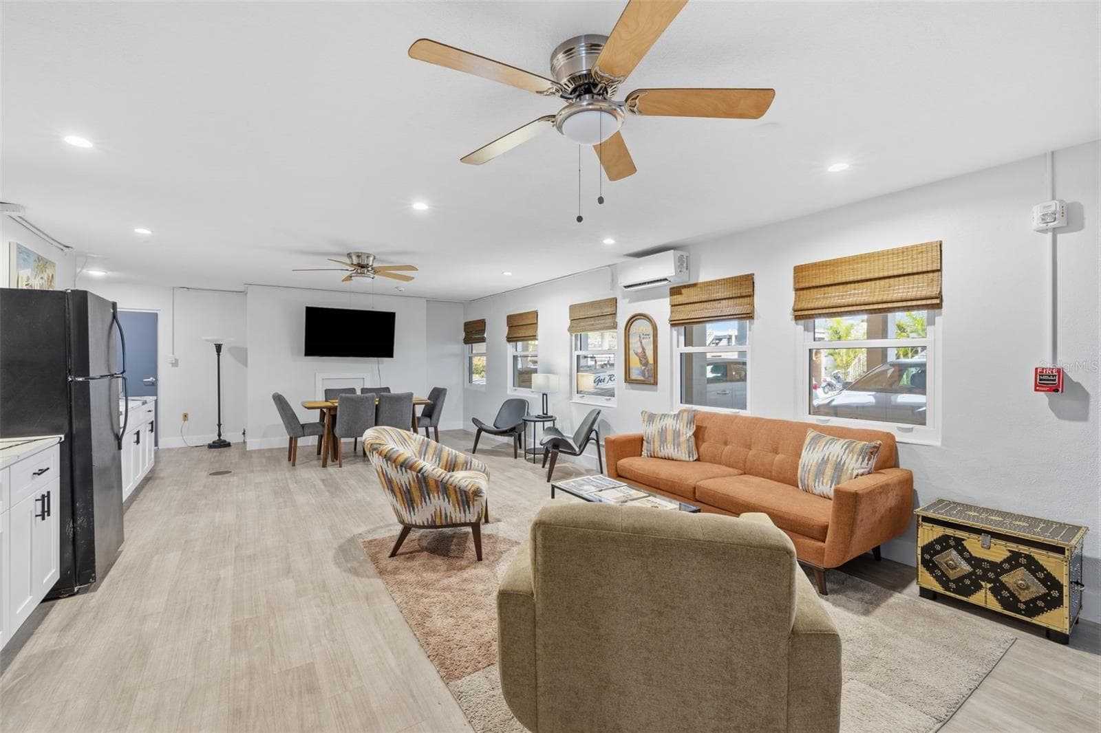 The community room provides multiple seating and gathering areas for residents and guests. - 841 4TH AVE N #27, ST PETERSBURG