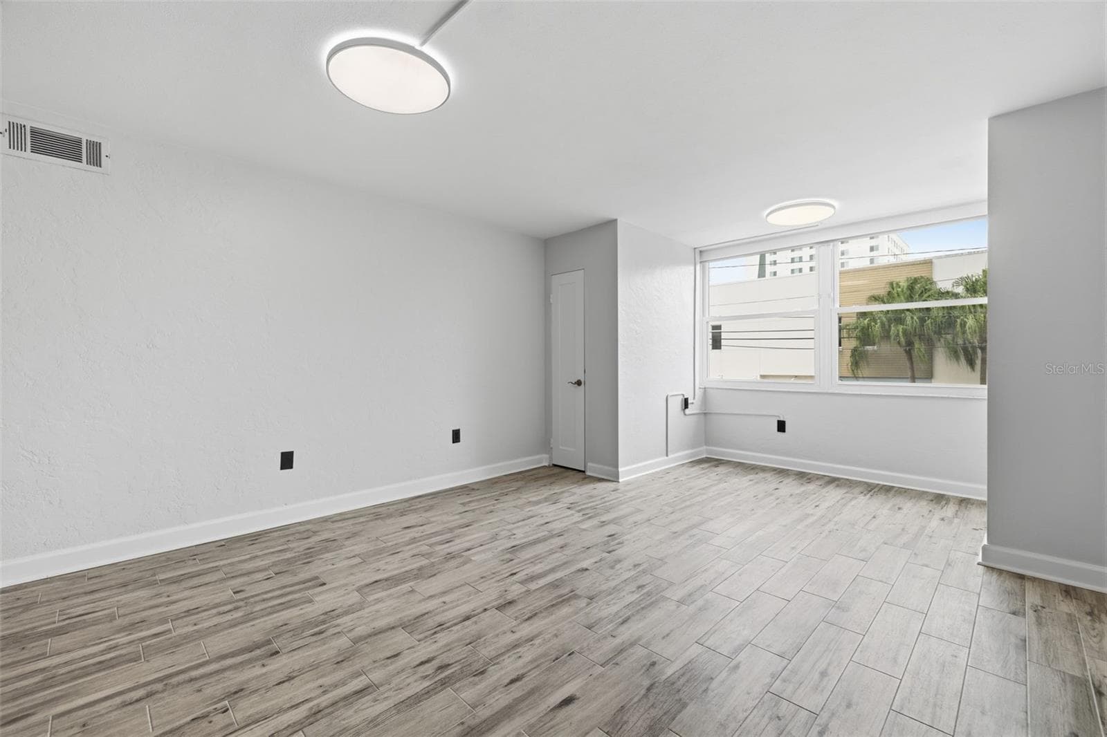 Fresh paint, new flooring, updated doors and hardware create a clean, cohesive feel throughout the home. - 841 4TH AVE N #27, ST PETERSBURG