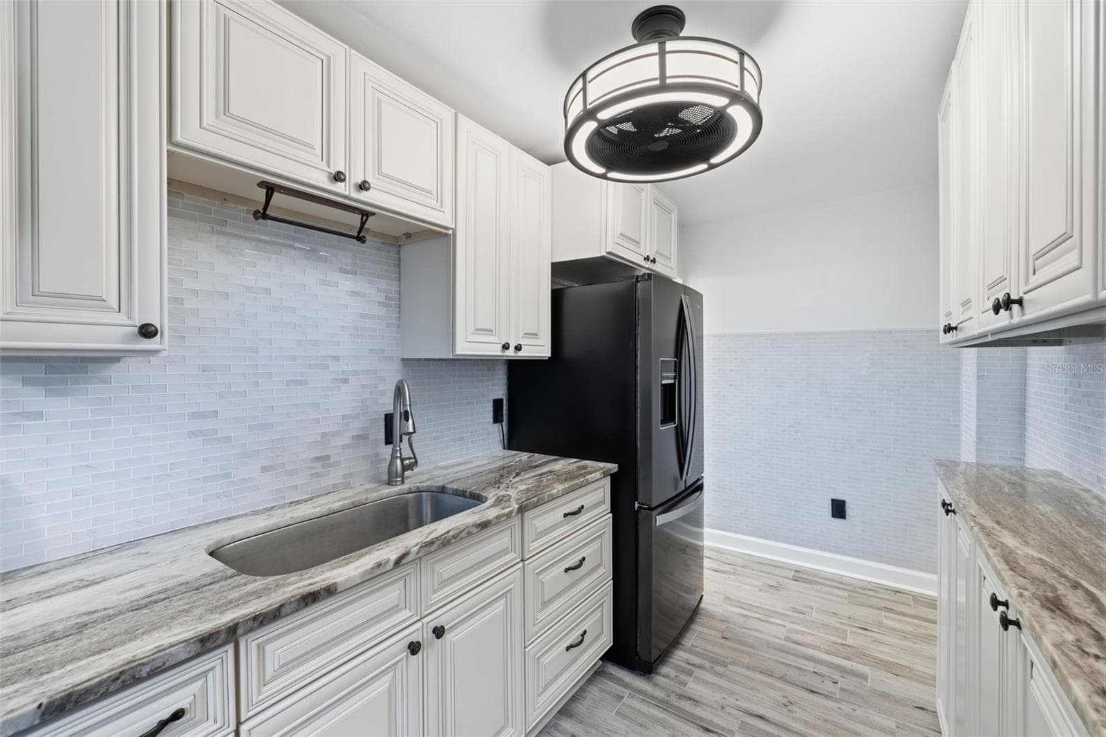 Updated kitchen with a bright, neutral palette that flows seamlessly with the rest of the home. - 841 4TH AVE N #27, ST PETERSBURG