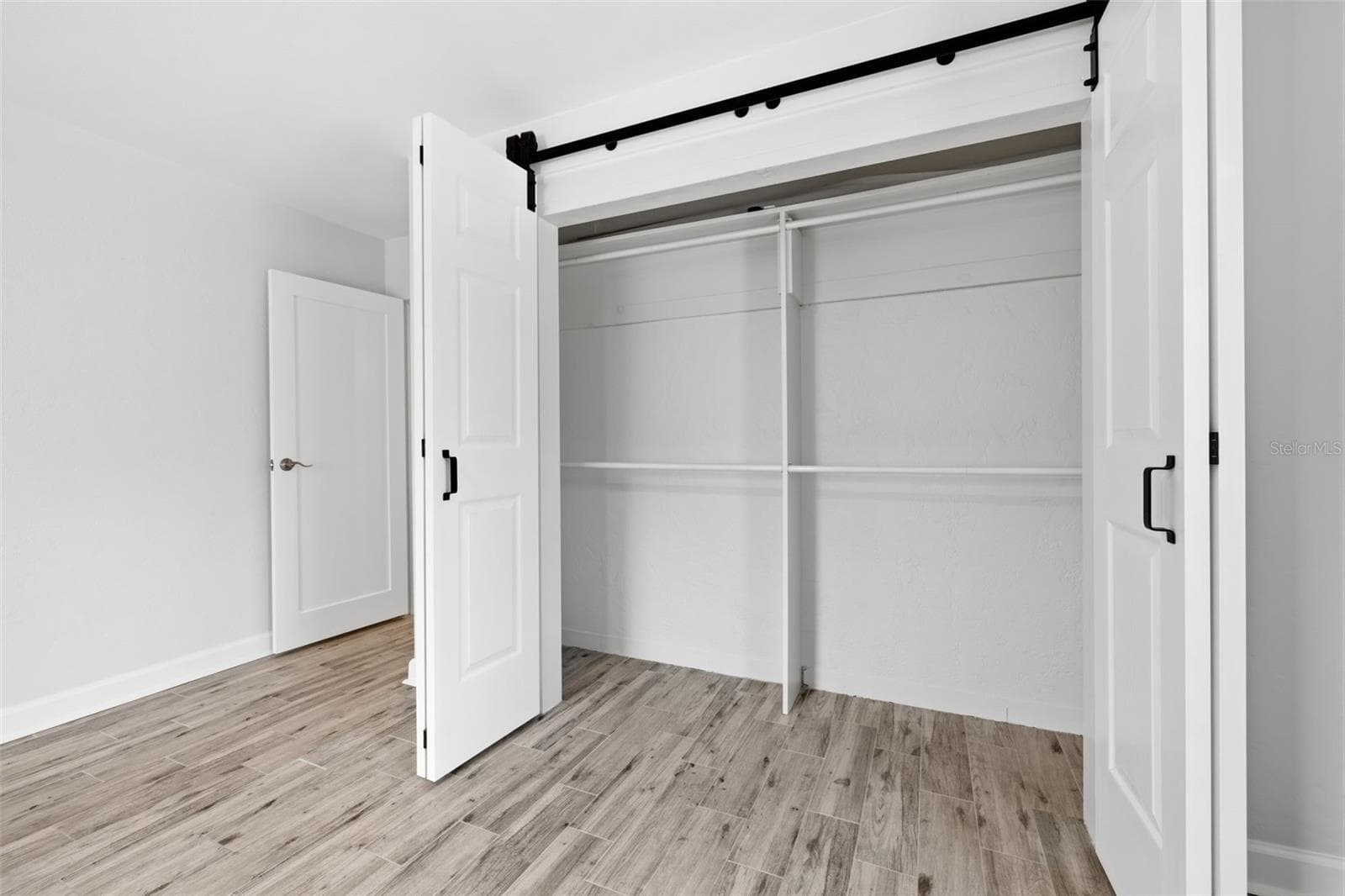 Generous closet space provides convenient storage within the primary bedroom. - 841 4TH AVE N #27, ST PETERSBURG