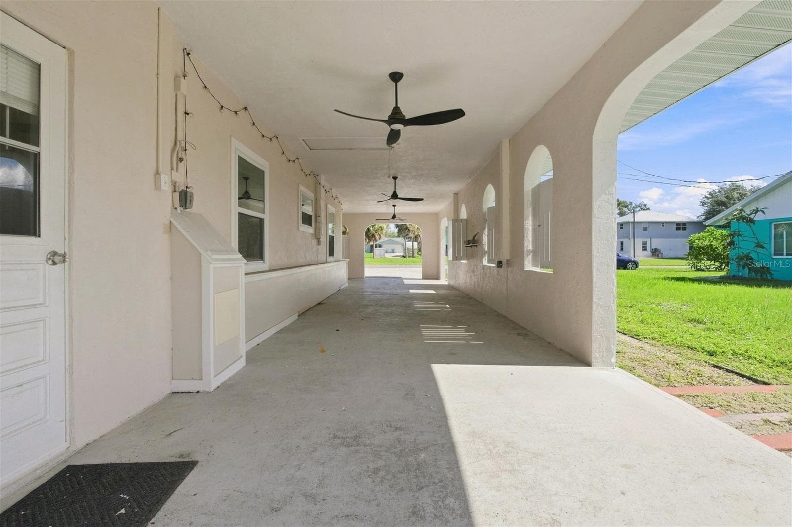 Expansive Tandem 3-Car Carport with Three Bahama Style Fans - 1005 ALSTON LN, ENGLEWOOD