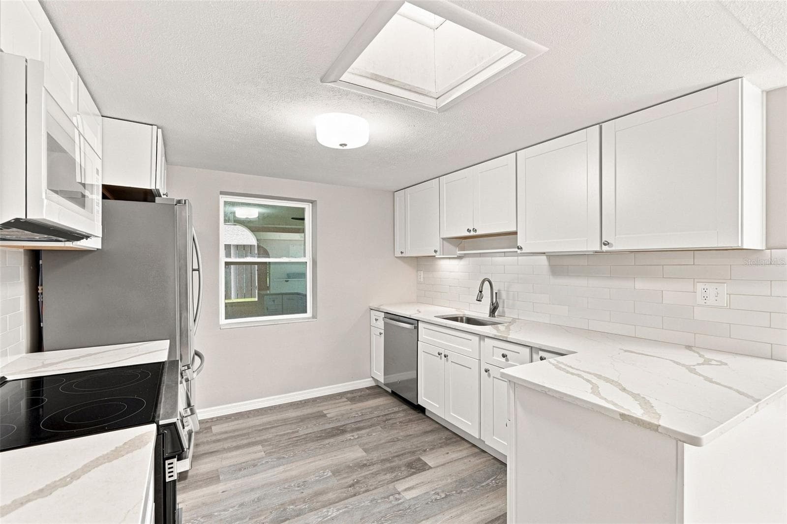 Beautifully Renovated Galley Kitchen with Quartz Countertops - 1005 ALSTON LN, ENGLEWOOD