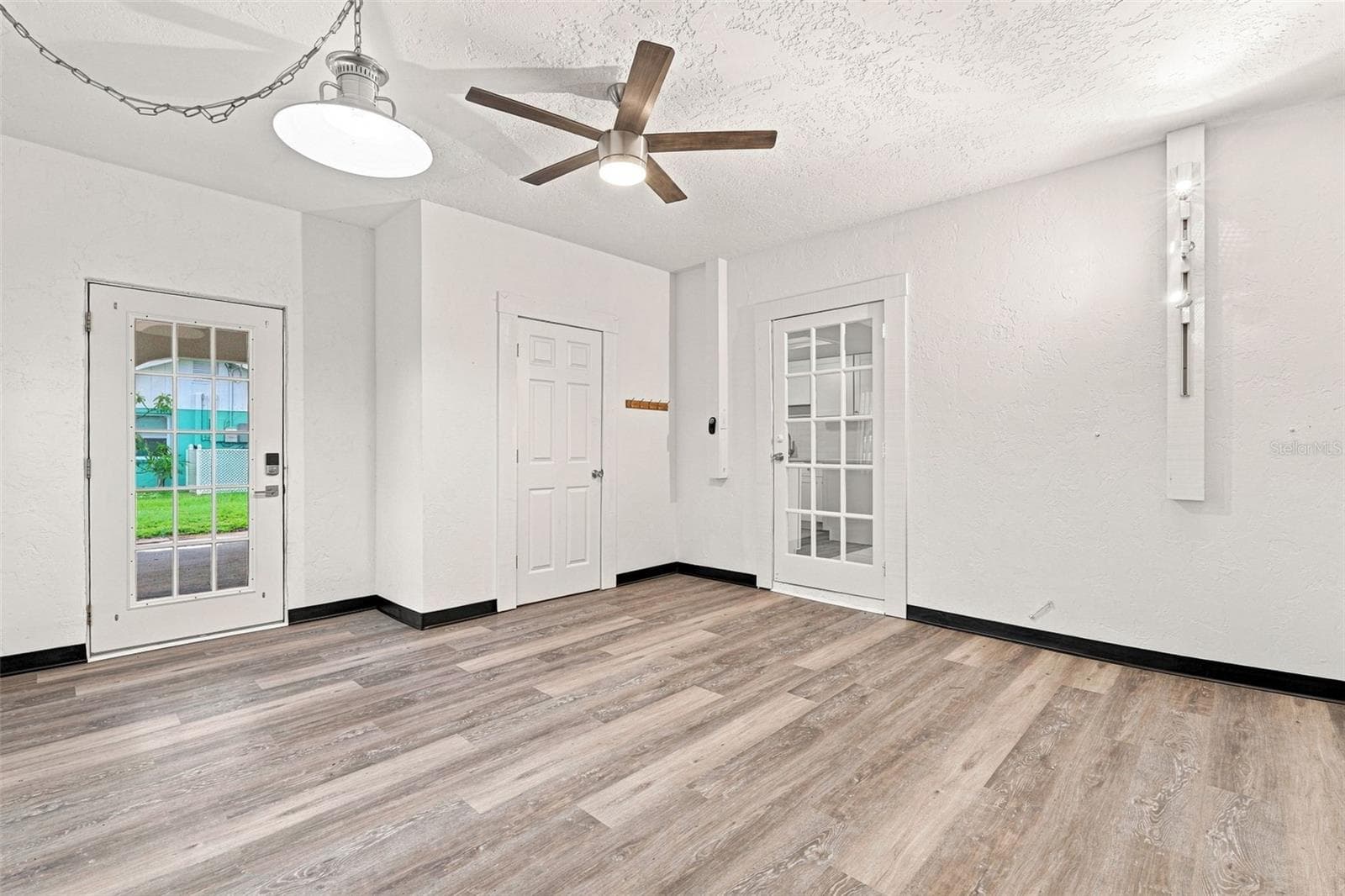 Family Room with Convenient Access to the Carport and Storage Room - 1005 ALSTON LN, ENGLEWOOD