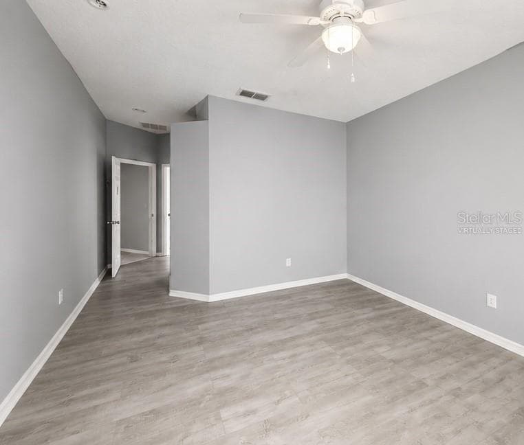 Primary Bedroom Virtually Staged - 1287 LEGENDARY BLVD, CLERMONT