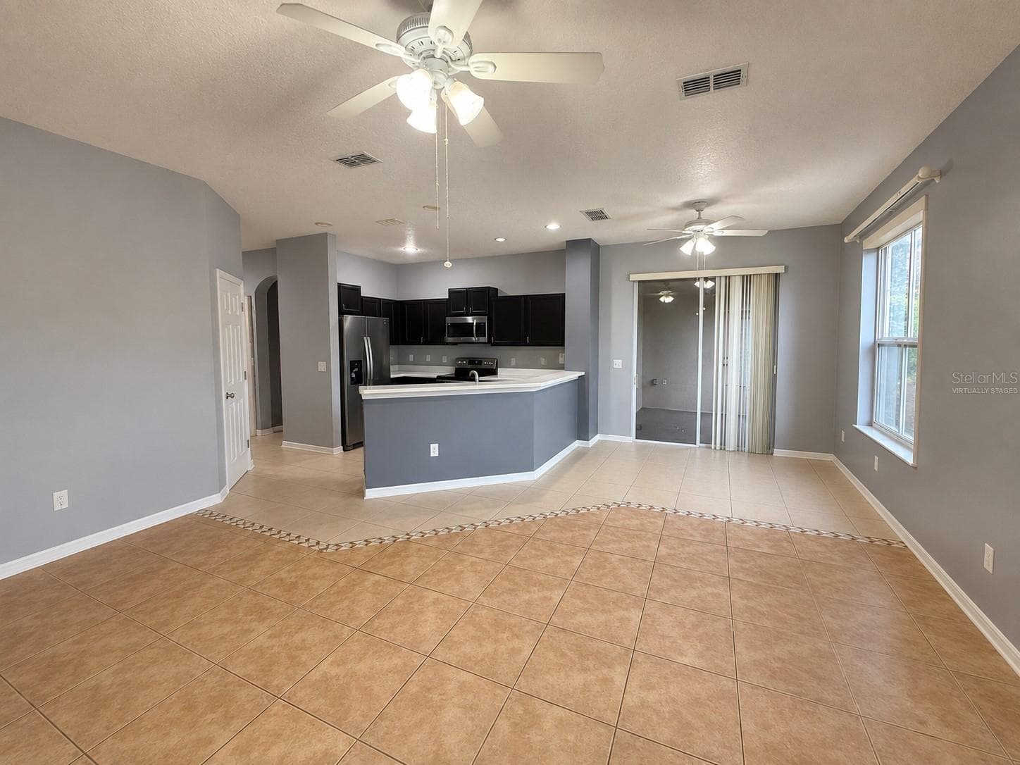 Great Room/Kitchen Virtually Staged - 1287 LEGENDARY BLVD, CLERMONT
