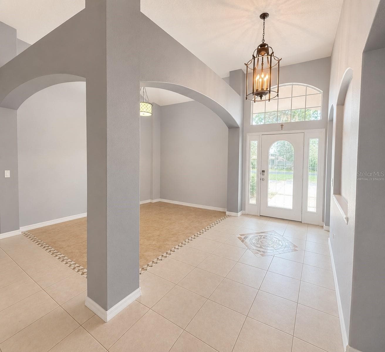 Foyer and Formal Dining Room Virtually Staged - 1287 LEGENDARY BLVD, CLERMONT