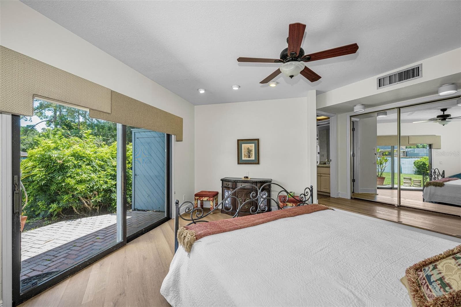 Master suite looking out to the back patio and back yard. One of the largest private back yards in the community. - 10479 LONGWOOD DR, SEMINOLE