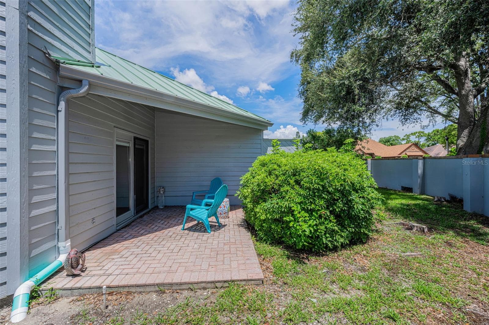 Patio outside the living room area. - 10479 LONGWOOD DR, SEMINOLE
