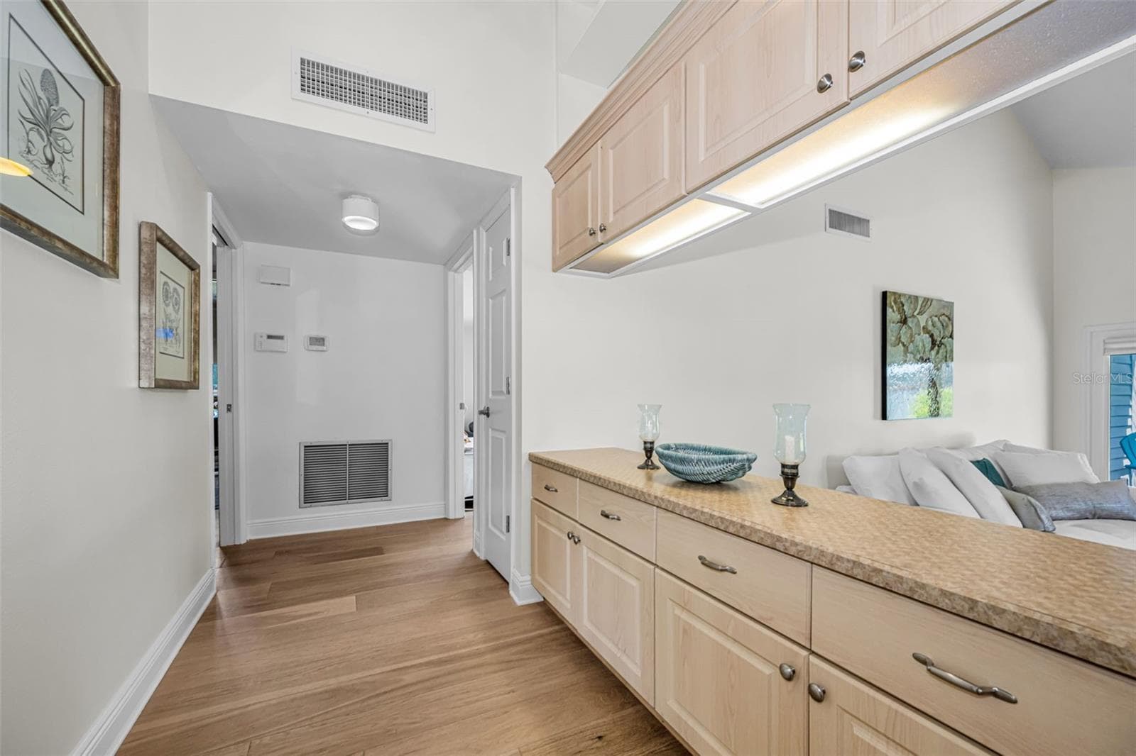 Hallway to the bedrooms; master on your right. Two others plus the shared bath on your left. New Air conditioner! - 10479 LONGWOOD DR, SEMINOLE