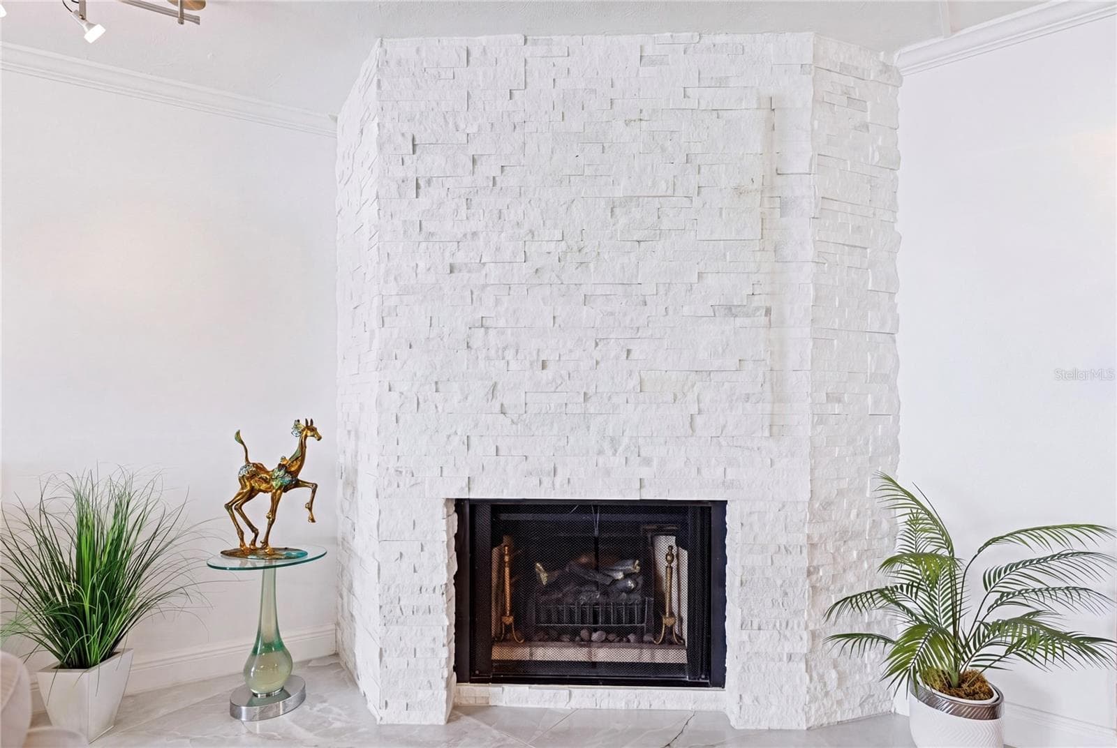 The natural stone facade flows throughout the home tying each space together in perfect harmony. - 1660 GULF BLVD #PH1, CLEARWATER BEACH