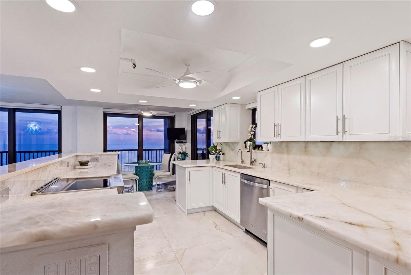 The same area at sunset with nature providing a radiant glow. - 1660 GULF BLVD #PH1, CLEARWATER BEACH