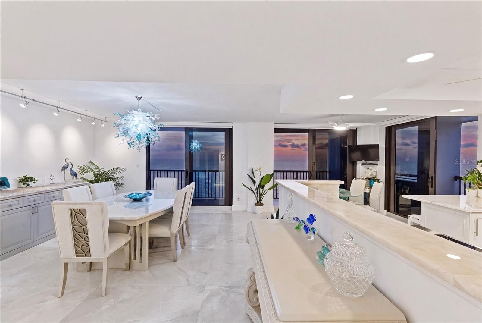 The neutral splendor of the interior allows the sunset to take your breath away. - 1660 GULF BLVD #PH1, CLEARWATER BEACH