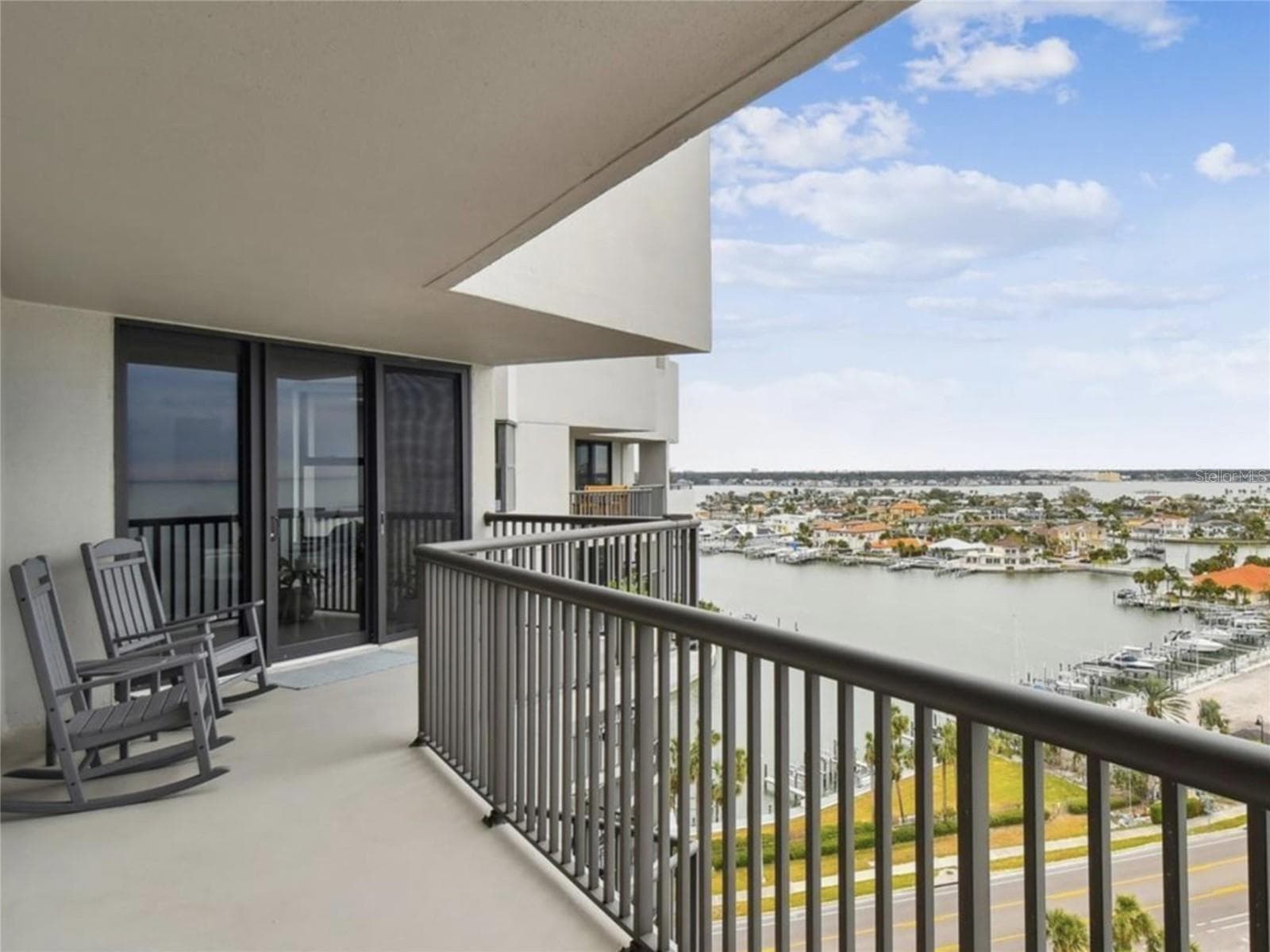 Watch boats sail past and the lights twinkle at night. Read peacefully or entertain. The options are endless with this enormous wrap-around balcony accessible from every bedroom. - 1660 GULF BLVD #PH1, CLEARWATER BEACH