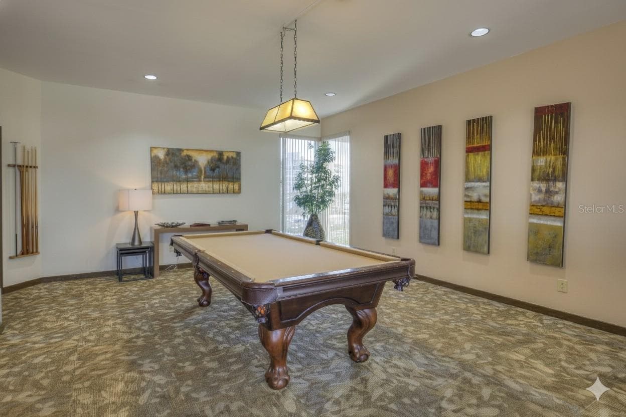 Billiard area of the parlor located in the common area building and upstairs from the fitness room. - 1660 GULF BLVD #PH1, CLEARWATER BEACH