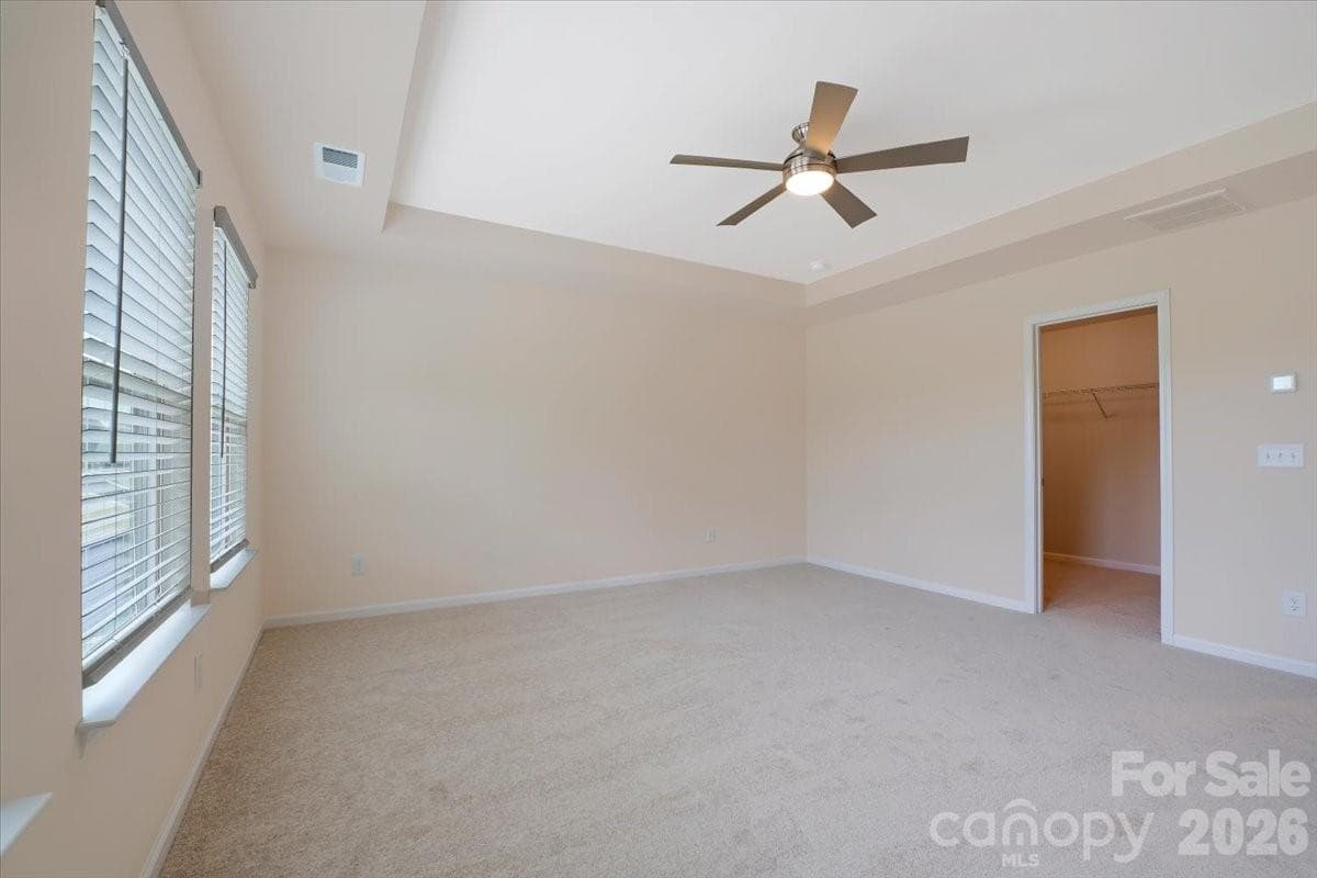 Primary suite with tray-ceiling, new carpet and walk-in closet - 15505 Davidson East Drive, Davidson