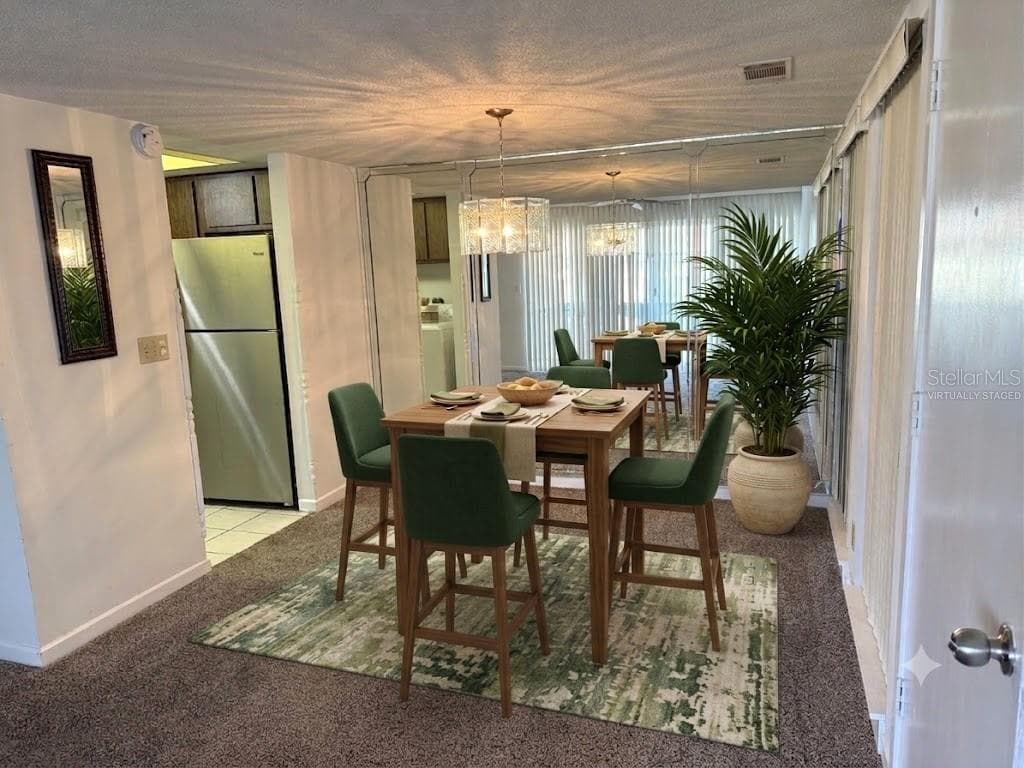 VIRTUALLY STAGED DINING AREA OFF THE KITCHEN - 42 CLUB HOUSE DR #207, PALM COAST