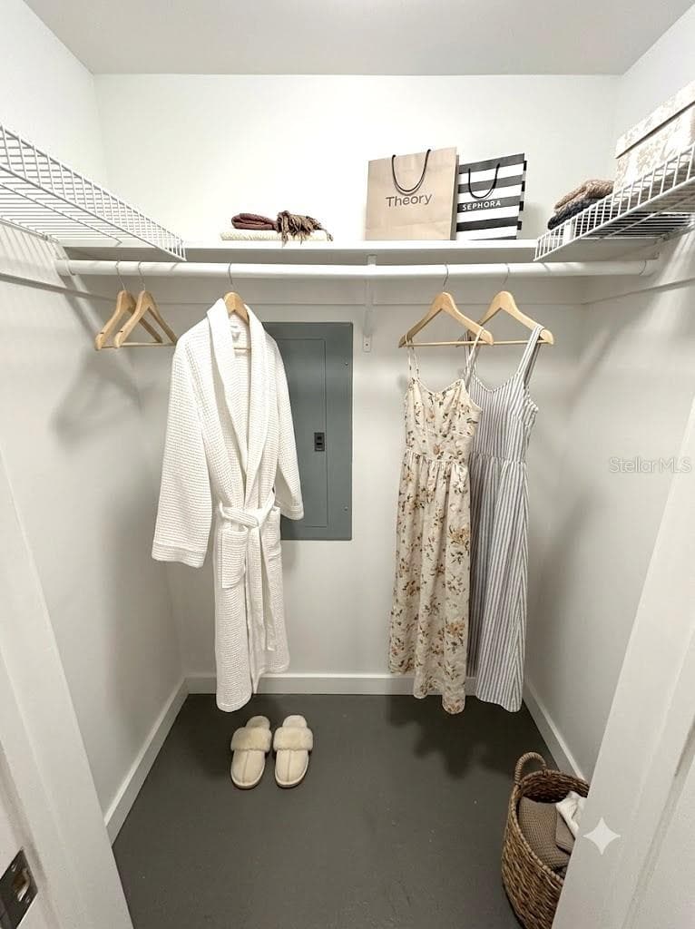 STAGED GUEST WALK IN CLOSET - 42 CLUB HOUSE DR #207, PALM COAST