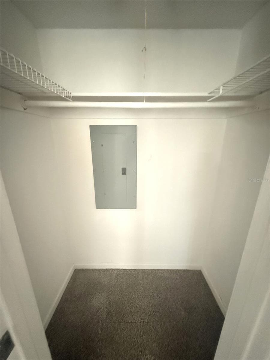 UNSTAGED GUEST WALK IN CLOSET - 42 CLUB HOUSE DR #207, PALM COAST