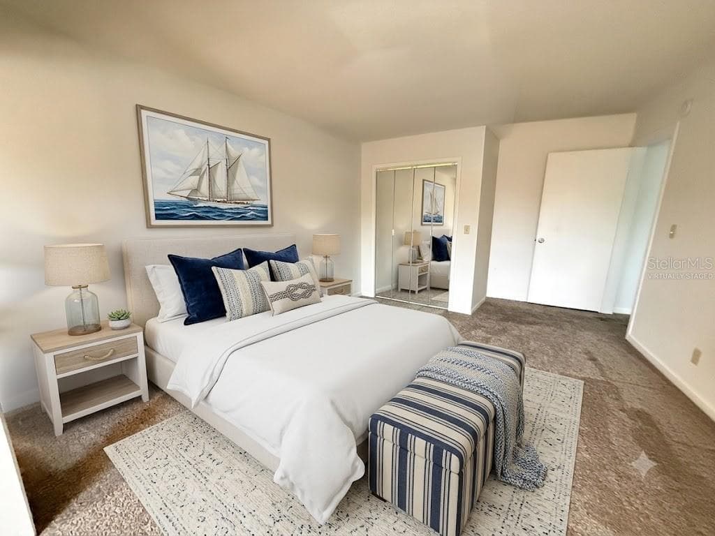 VIRTUALLY STAGED PRIMARY BEDROOM - 42 CLUB HOUSE DR #207, PALM COAST