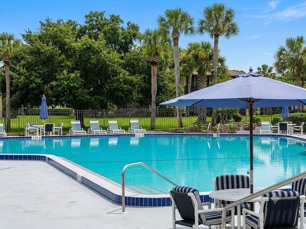 LARGE UMBRELLAS PROVIDE SHADE - 42 CLUB HOUSE DR #207, PALM COAST