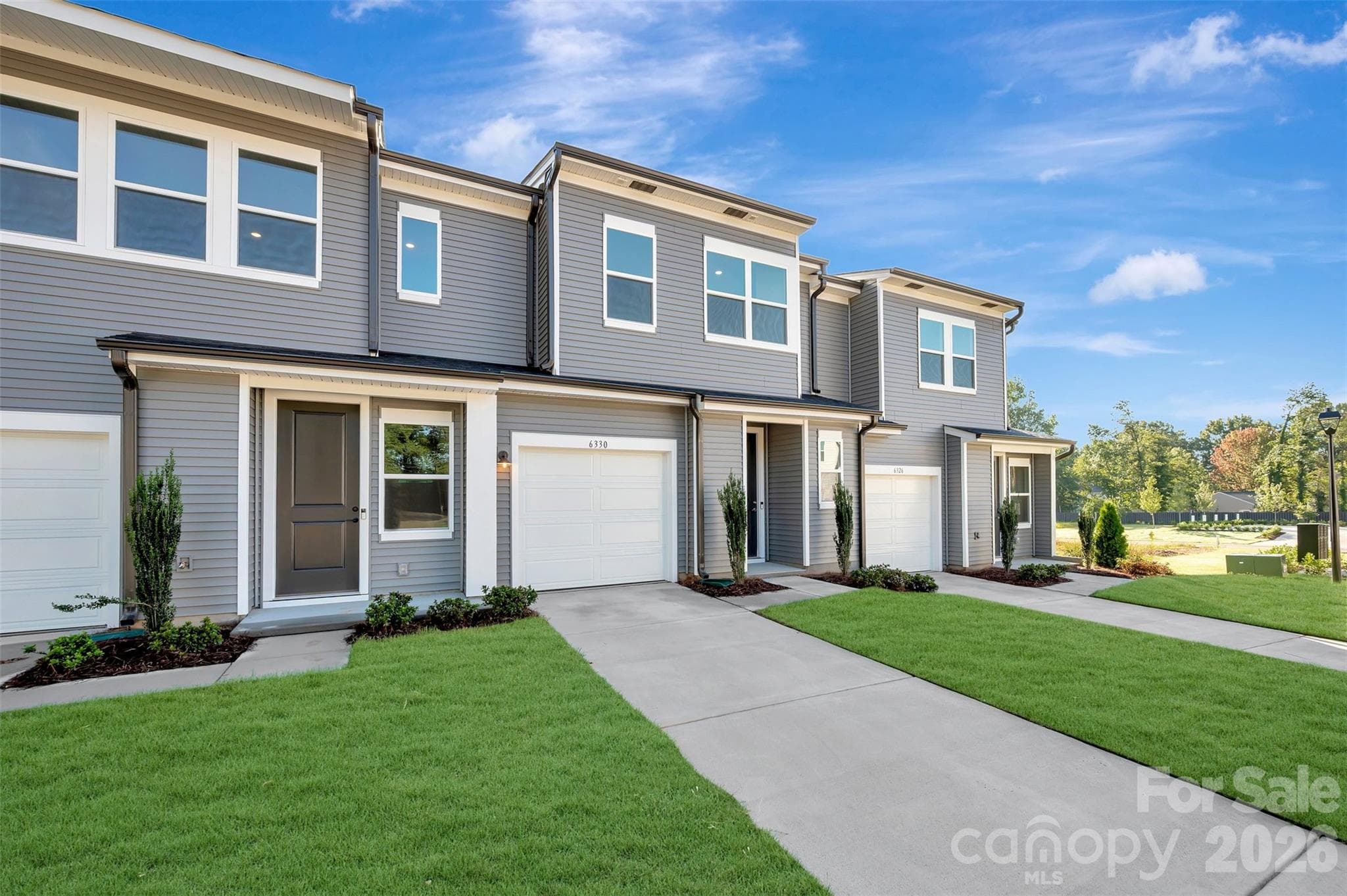 Covered Front Entrance & Front-Load Garage - Charlotte