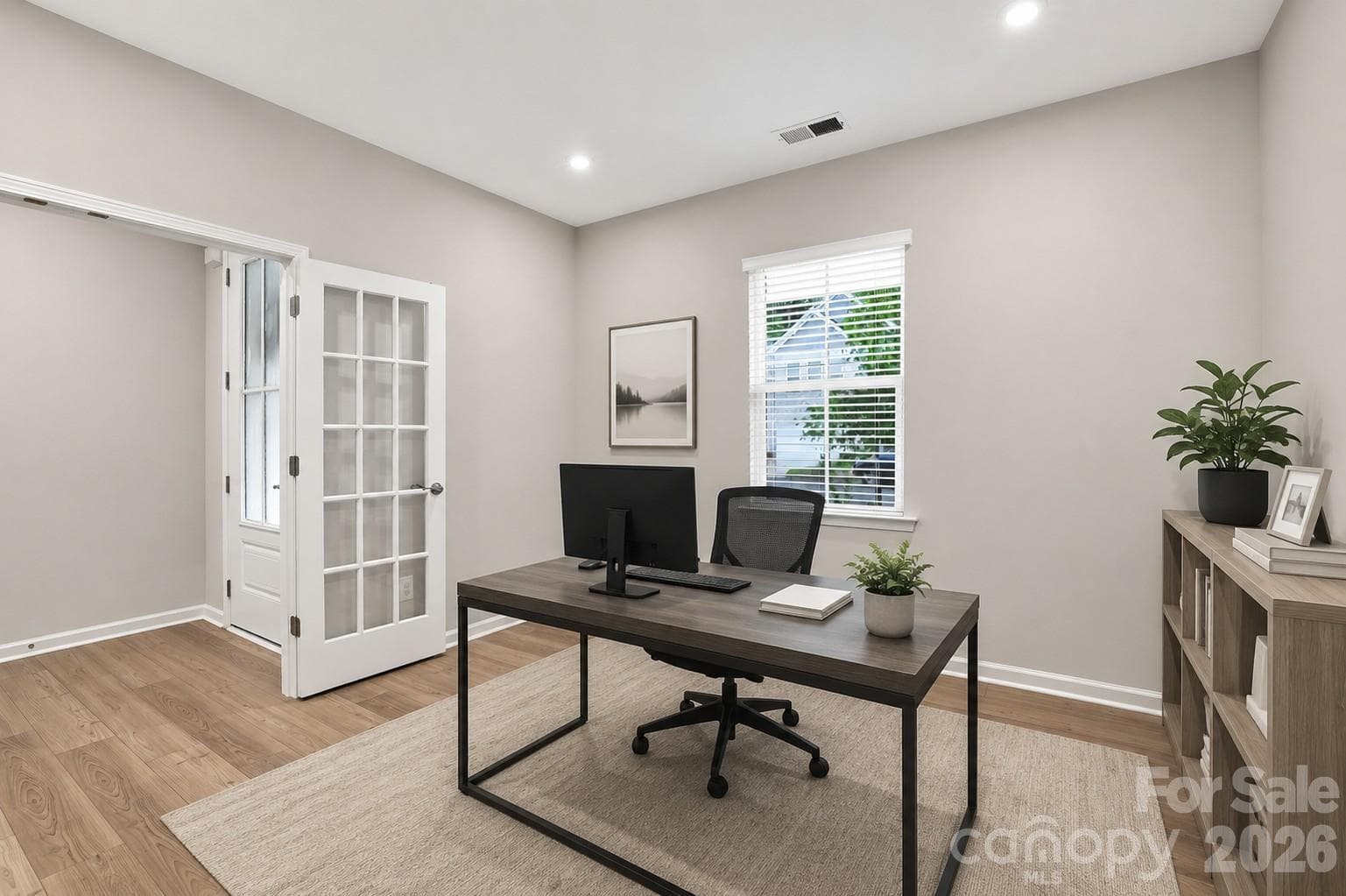Luxury vinyl plank flooring in the flex space complete with French doors. Virtually staged. - 8226 Franklin Trail Street, Mint Hill