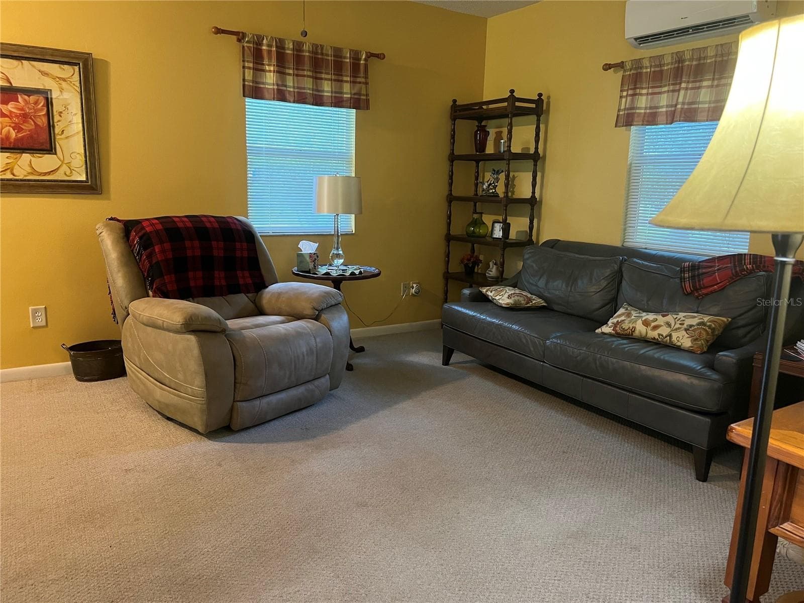 Guest house living room featuring comfortable seating area and abundant natural light. - 267 N ORANGE AVE, LAKE HELEN