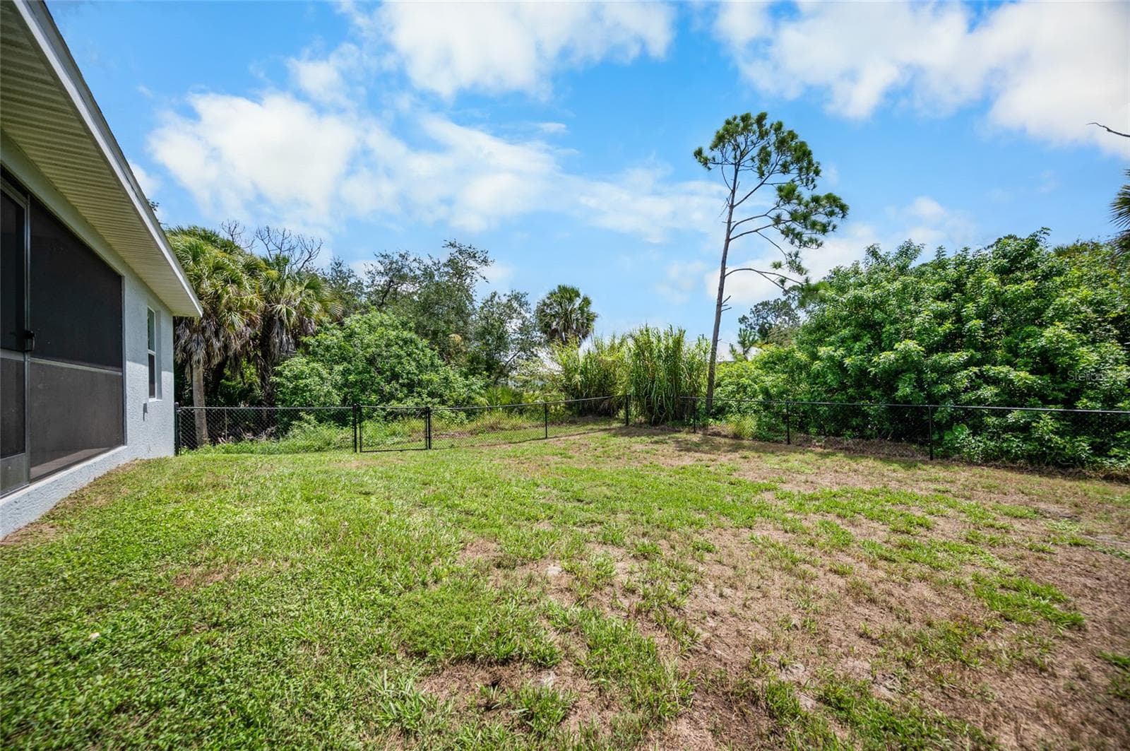Fully fenced back yard - 315 SWEETWATER DR, ROTONDA WEST