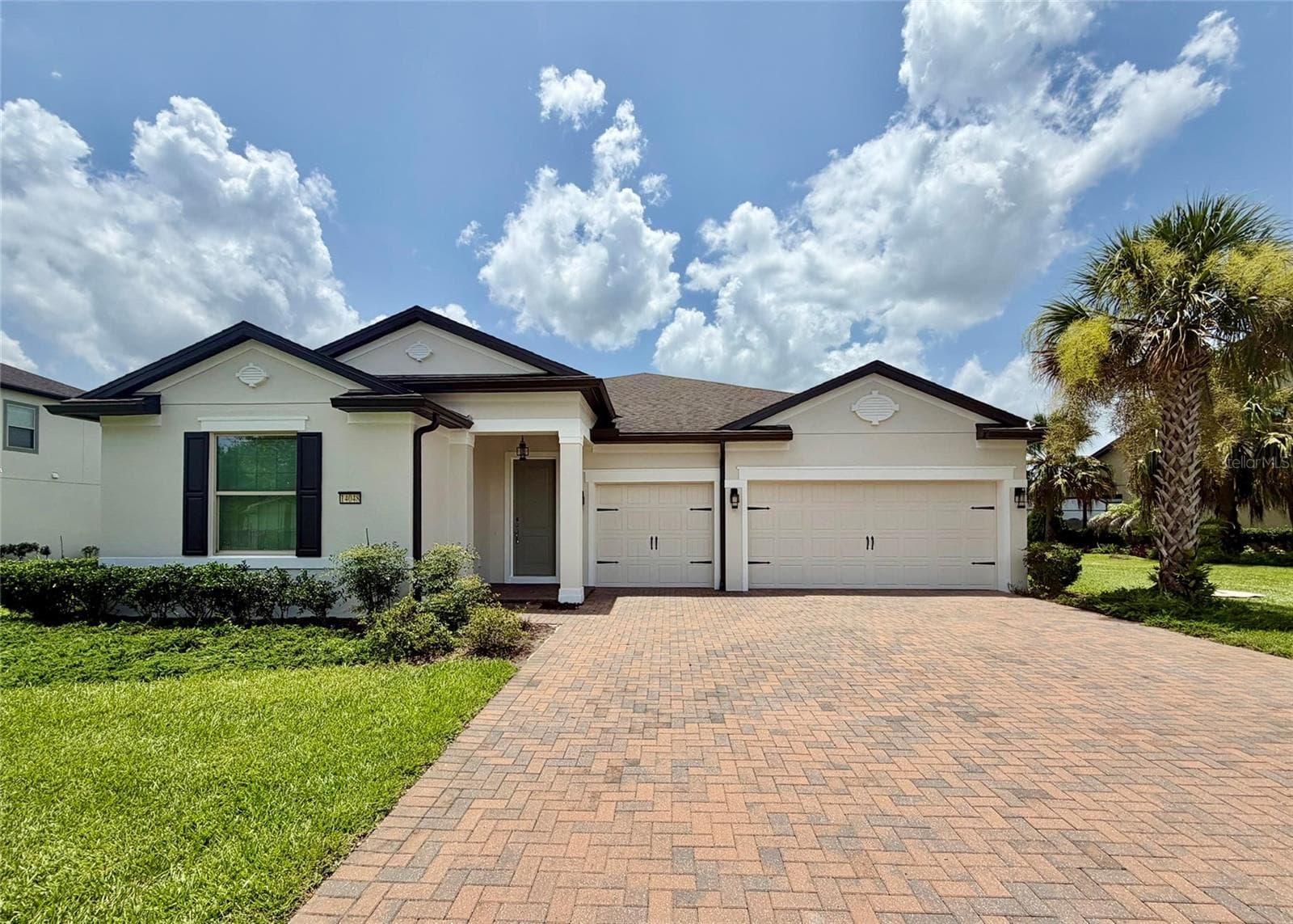 14048 Larkspur Lake Dr - Front exterior with three-car garage and spacious driveway. - 14048 LARKSPUR LAKE DR, WINTER GARDEN