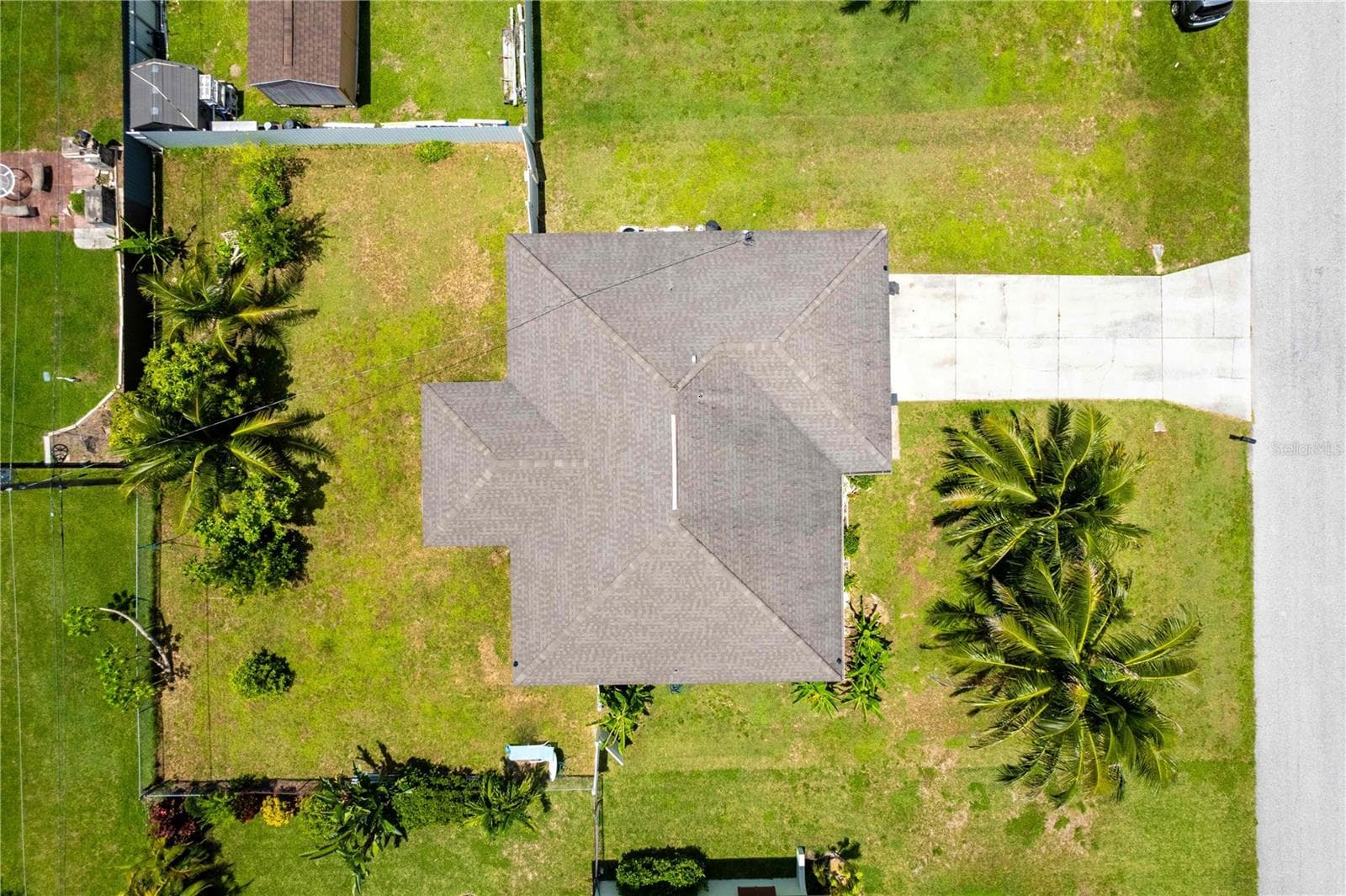 KEY FEATURES INCLUDE Newer Roof (2019), Newer A/C System (2021), Tile Floors Throughout, 2-Car Garage plus Concrete Driveway, Screen-Enclosed Lanai, Spacious Backyard – Room for a Pool, 0.23-Acre Lot (10,019 sq ft), 1,422 sq ft under air - 1728 NE 22ND TER, CAPE CORAL