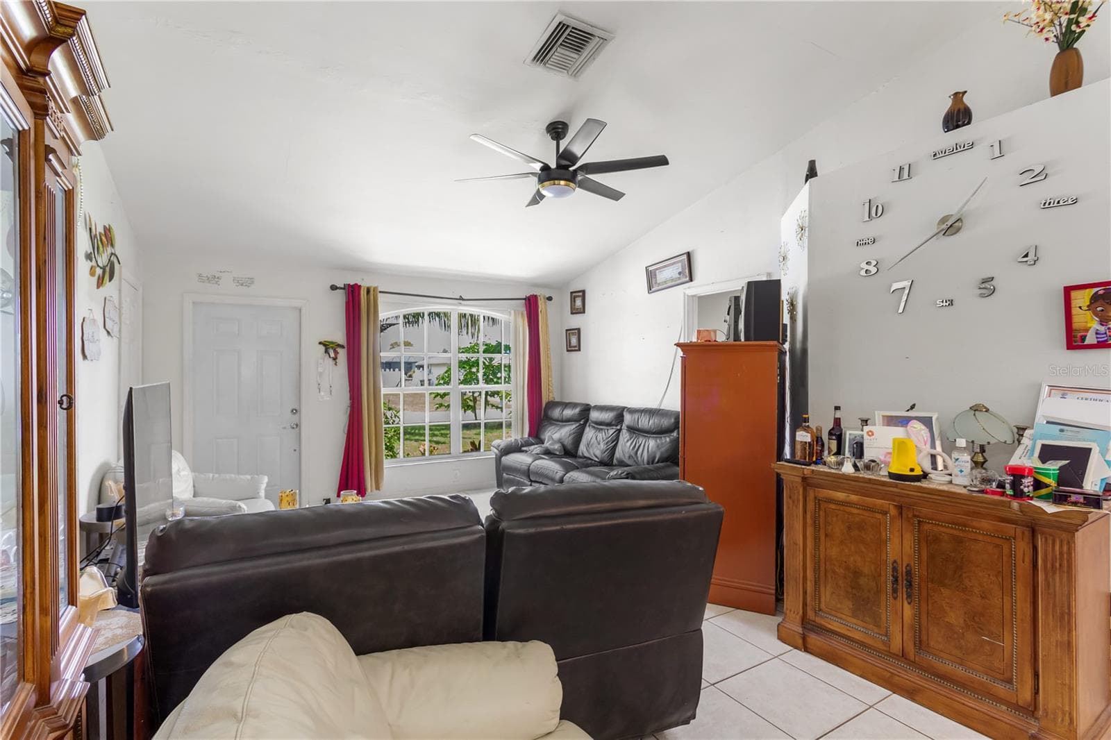 The PRIMARY SUITE is privately located on one side of the home and features a HALLWAY ENTRY with the IN-RESIDENCE LAUNDRY AREA conveniently tucked away. - 1728 NE 22ND TER, CAPE CORAL
