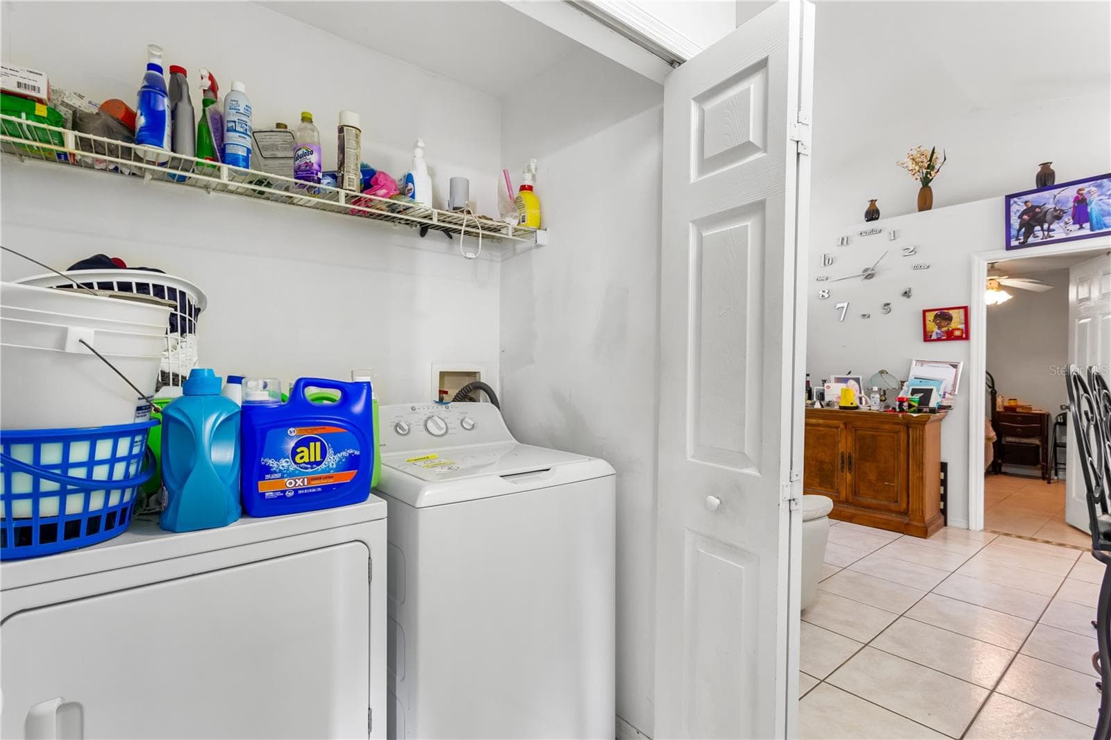 Master entry HALLWAY with the IN-RESIDENCE LAUNDRY AREA conveniently tucked away - 1728 NE 22ND TER, CAPE CORAL