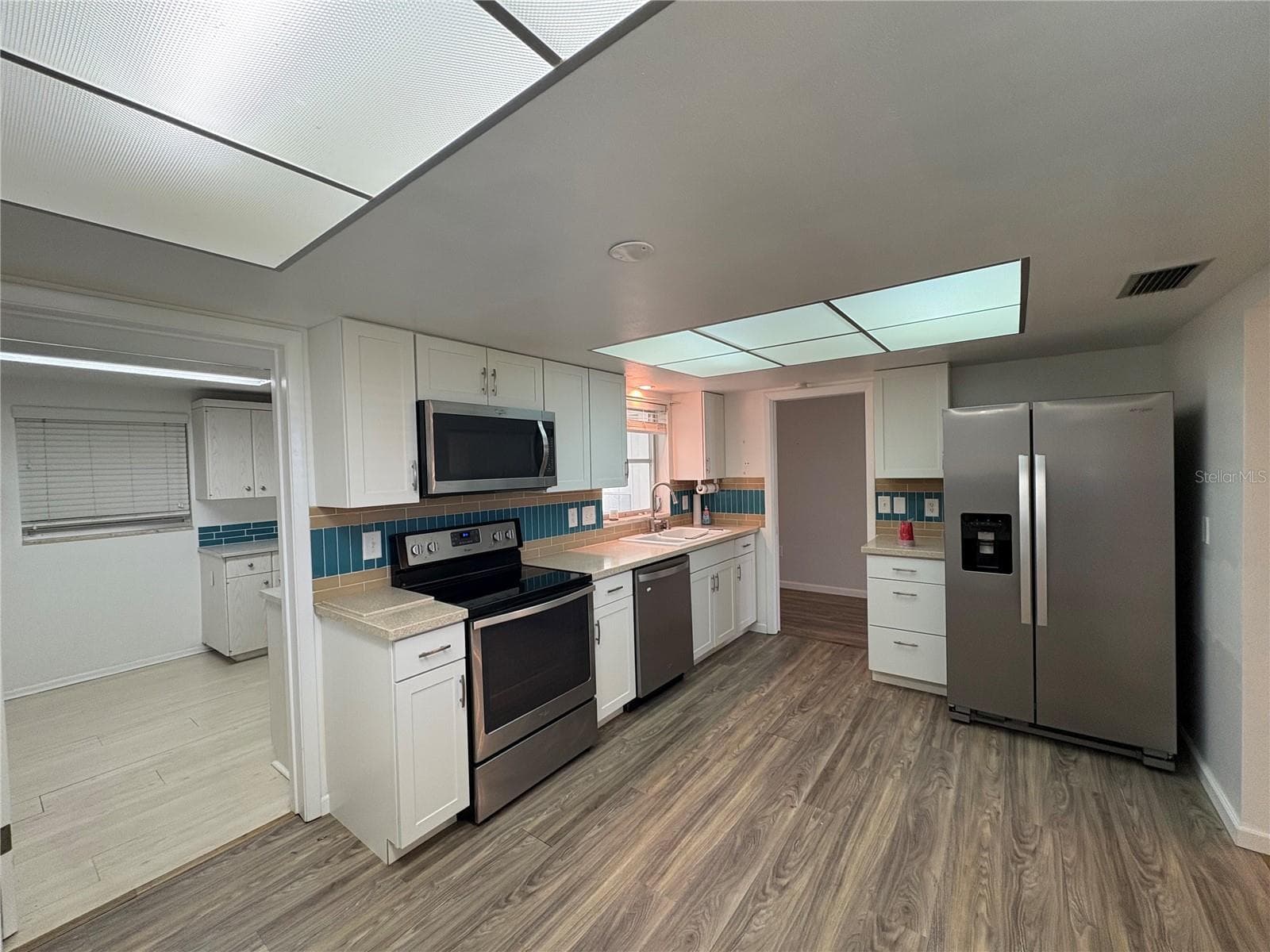 Kitchen into the Utility Room - 3276 BRUNSWICK LN #705, SARASOTA