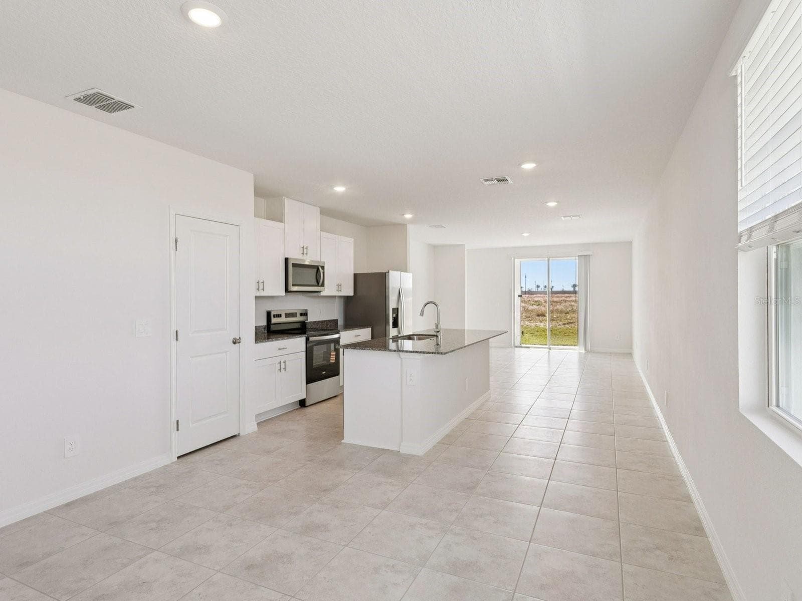 Photo is not of the actual home, but is an inspirational photo of builder’s model home and may depict options, furnishings, and/or decorator features that are not included - 729 IMPALA RD, LAKE ALFRED
