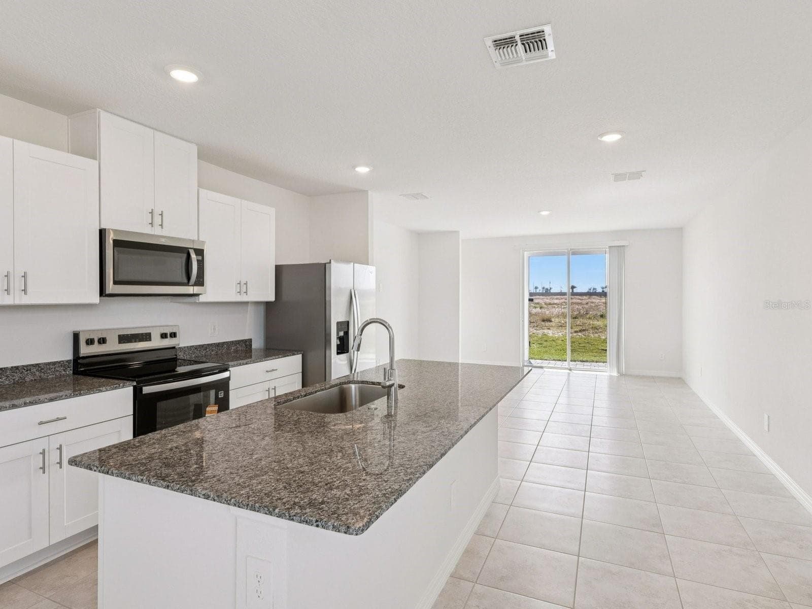 Photo is not of the actual home, but is an inspirational photo of builder’s model home and may depict options, furnishings, and/or decorator features that are not included - 729 IMPALA RD, LAKE ALFRED