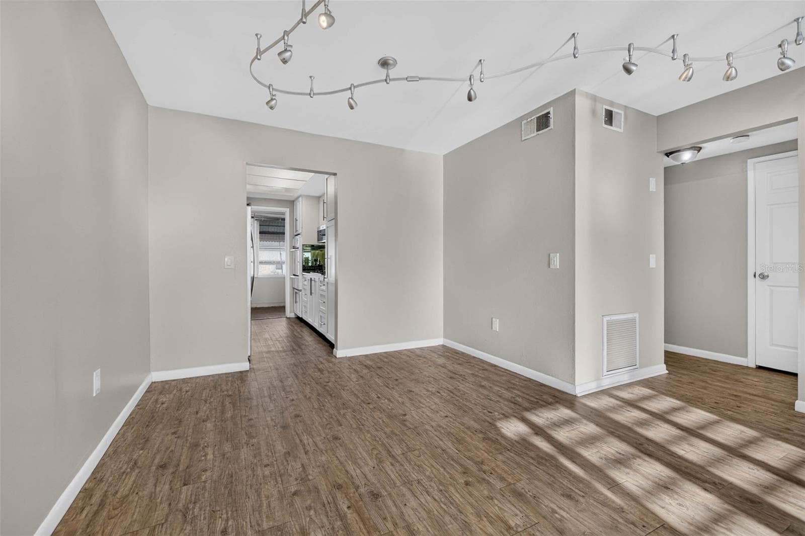 Neutral paint, and an open layout that flows seamlessly into the kitchen. - 6015 19TH ST N #215, ST PETERSBURG