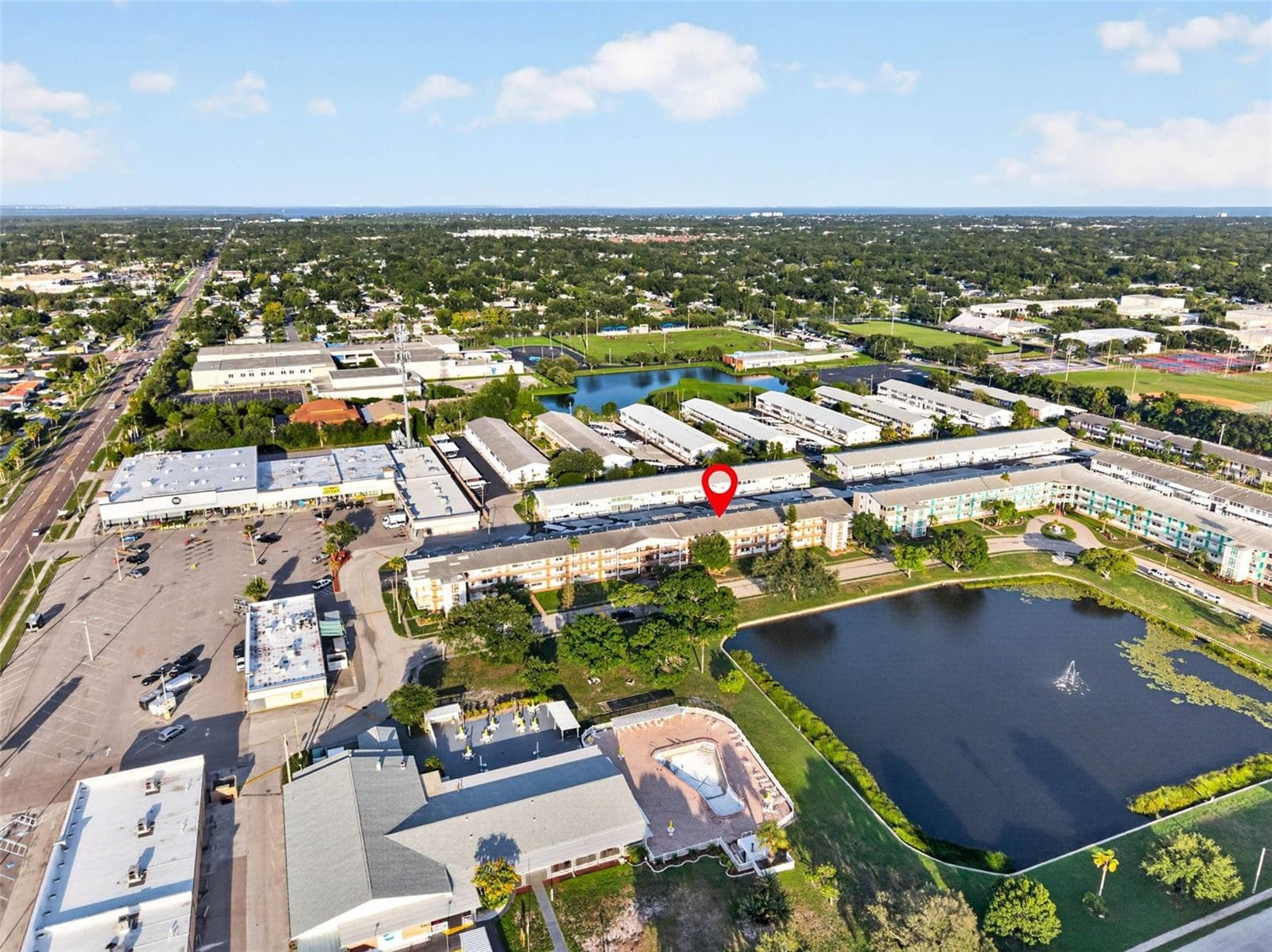 Aerial view highlighting the building's prime location within the community. - 6015 19TH ST N #215, ST PETERSBURG