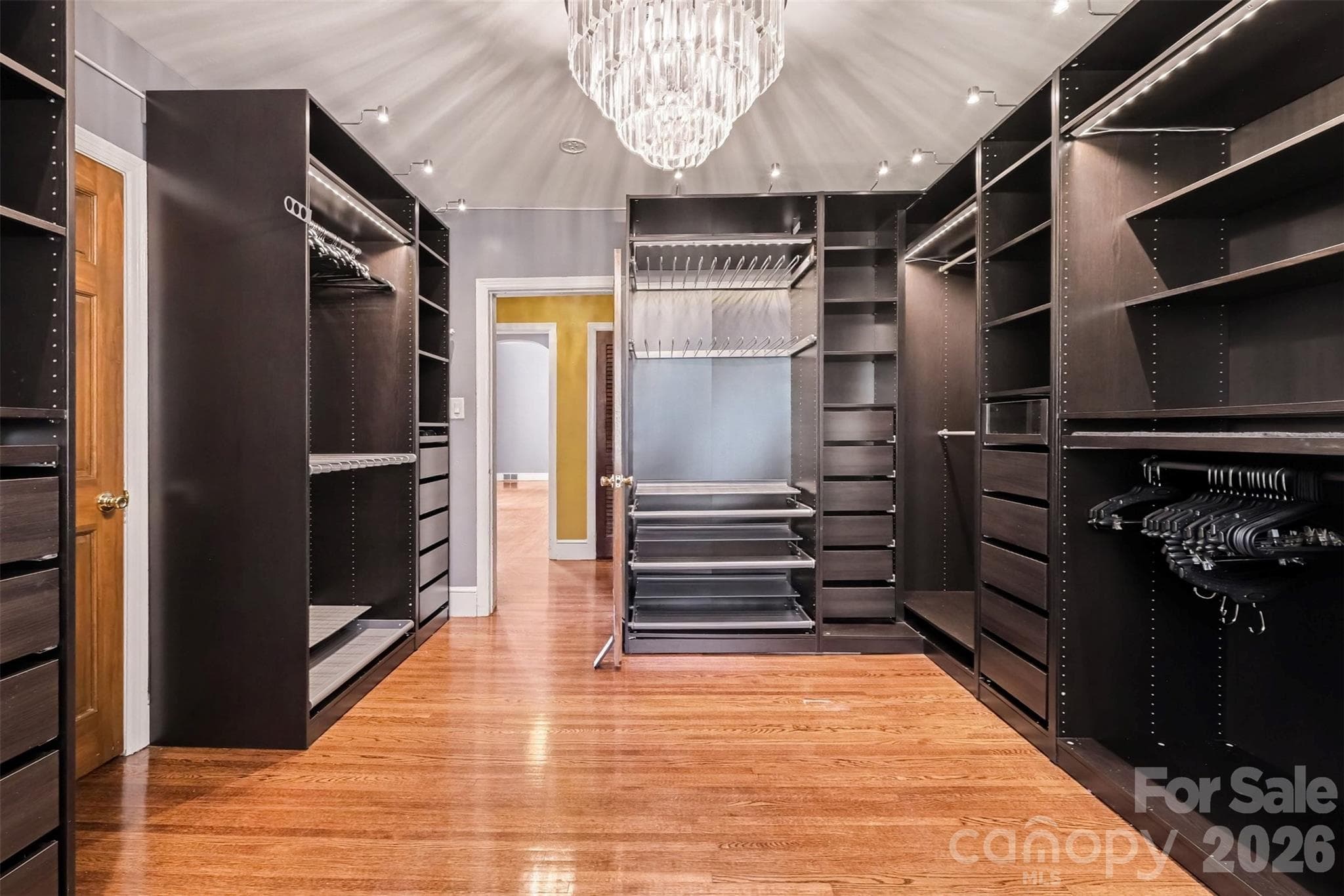 Bedroom 2 on Main Previously Primary Closet with Custom Built-In Shelves - 5914 Hanna Court, Charlotte