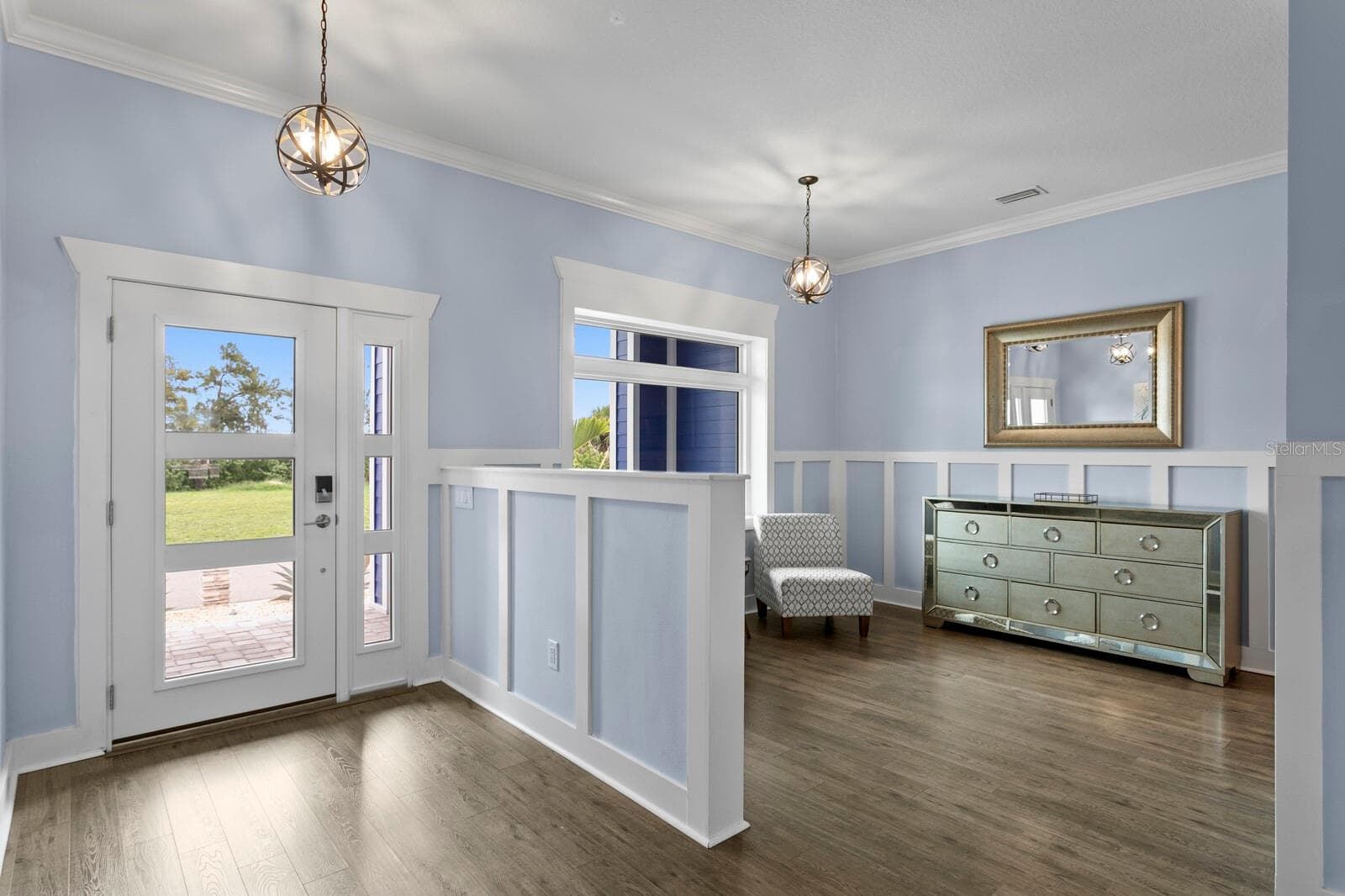 Enter through the Foyer opening to formal Living Room - 704 EAGLE LN, APOLLO BEACH