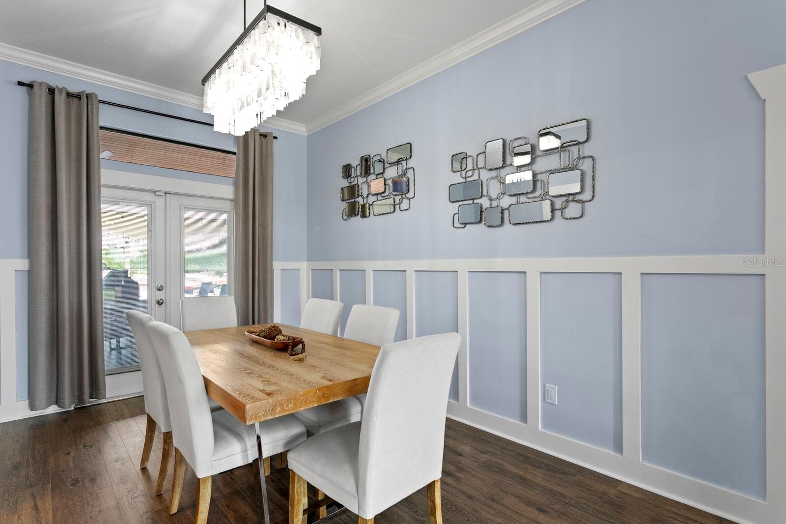 Formal Dining Room with french doors opening to covered rear patio - 704 EAGLE LN, APOLLO BEACH
