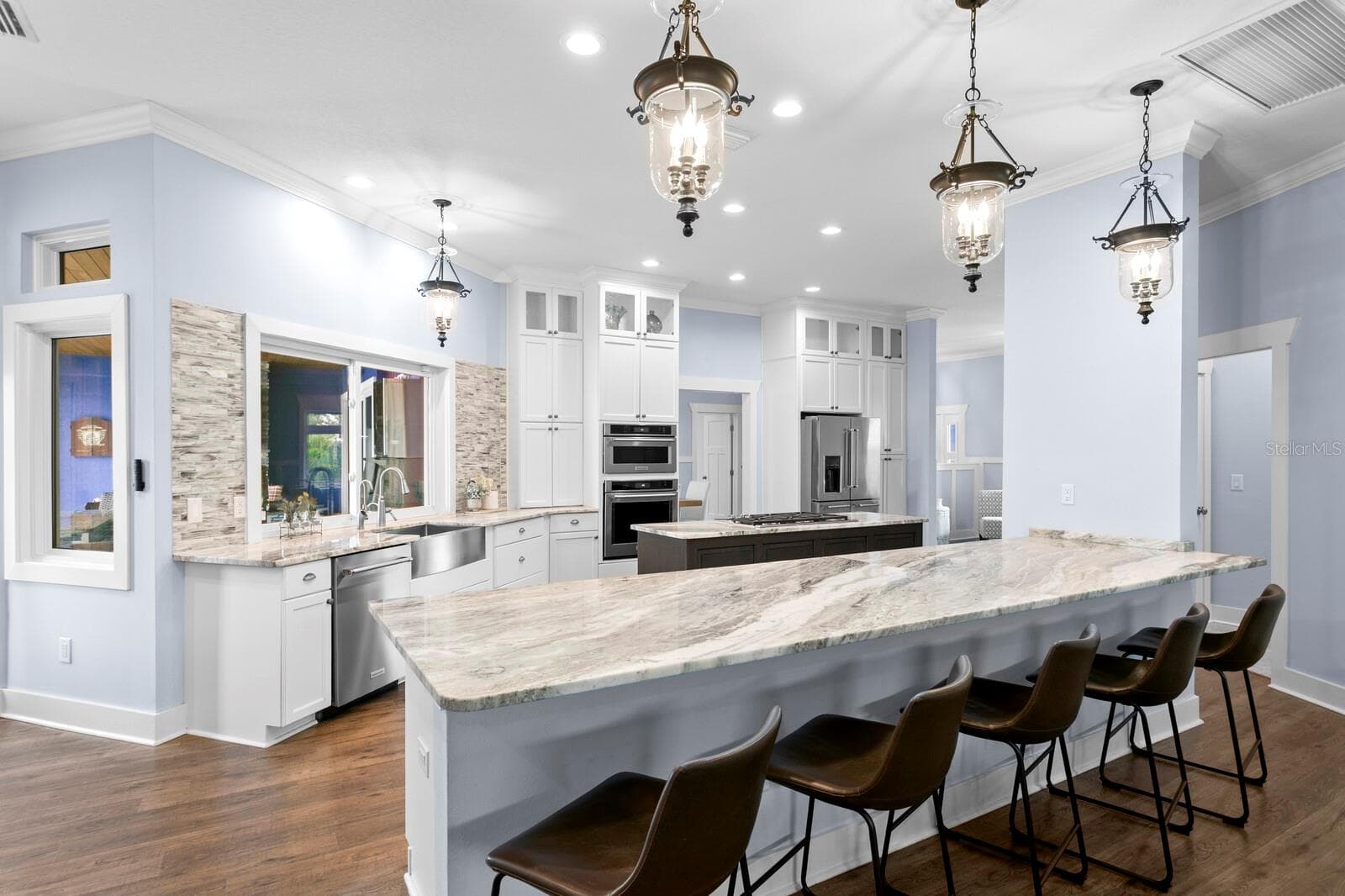 Large Kitchen island with Granite counters with breakfast bar seating - 704 EAGLE LN, APOLLO BEACH