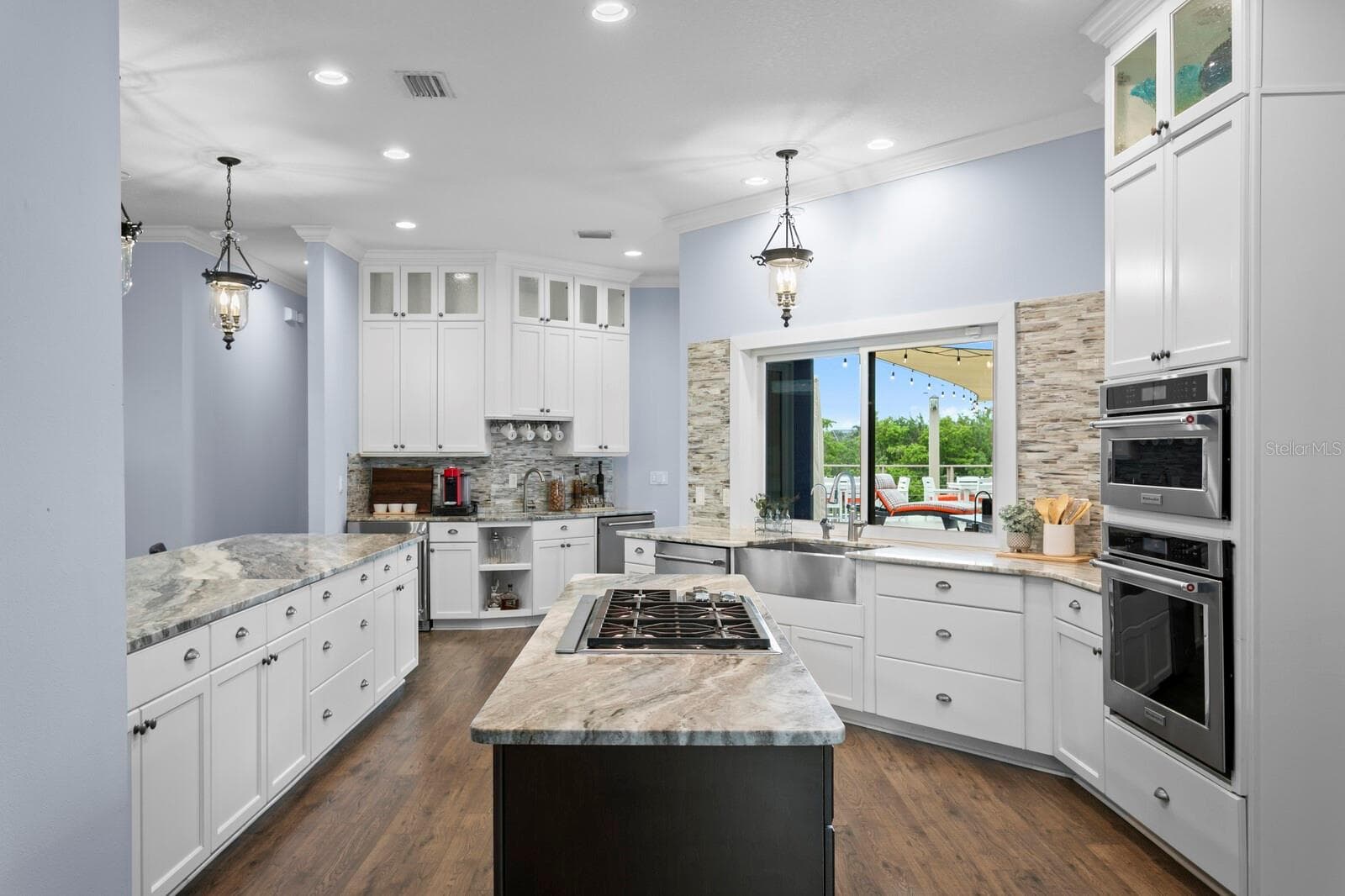 Kitchen features all stainless steel appliances, large farm sink and two dishwashers - 704 EAGLE LN, APOLLO BEACH