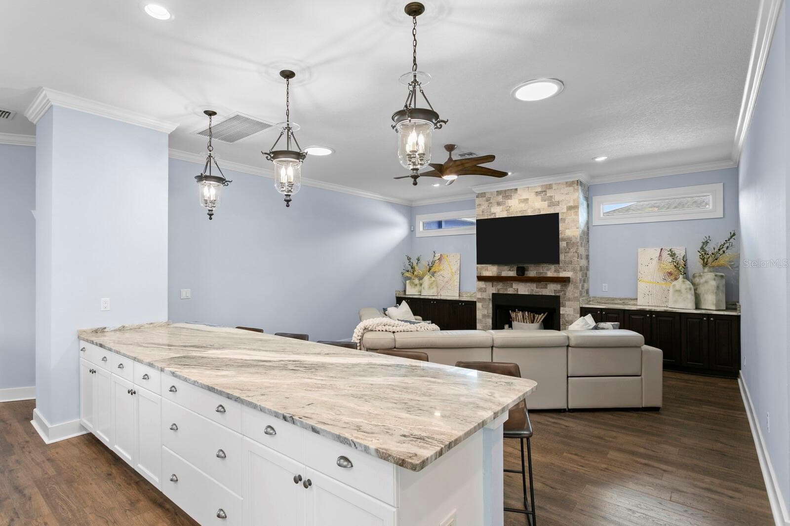 Ample Kitchen storage with large island opens to Family Room - 704 EAGLE LN, APOLLO BEACH