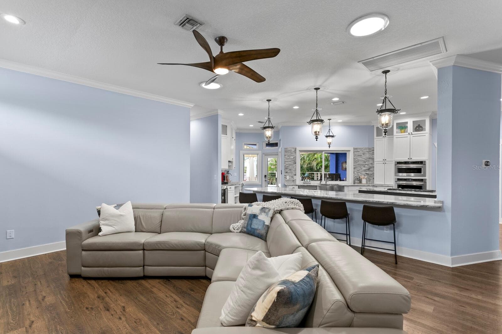 View from Family Room looking towards Kitchen and backyard oasis - 704 EAGLE LN, APOLLO BEACH
