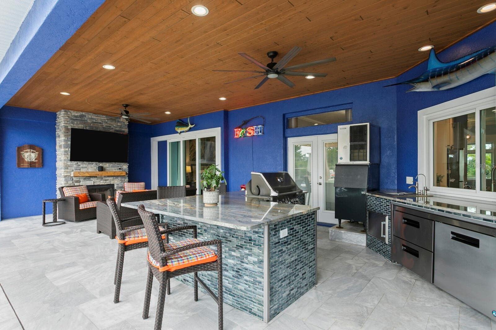Covered Patio with tongue and groove ceiling and ceiling fans - 704 EAGLE LN, APOLLO BEACH