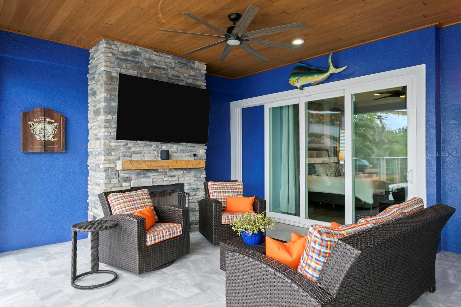 Propane fireplace just off Primary Bedroom with triple pocket sliding doors - 704 EAGLE LN, APOLLO BEACH