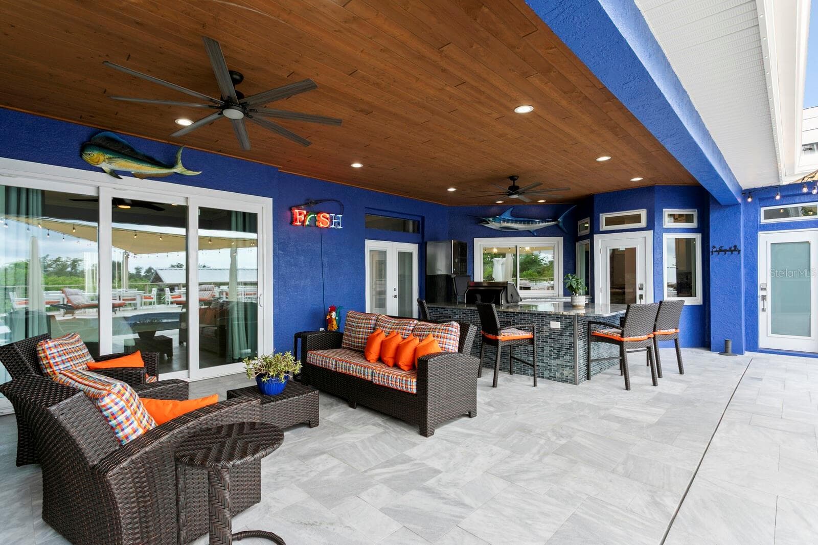 Covered Patio and Pool Deck feature sanded marble tile flooring - 704 EAGLE LN, APOLLO BEACH