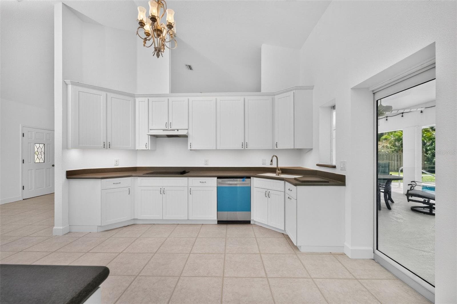 Updated Cottage style white cabinetry with solid surface countertops are easy to incorporate whatever your choice of color! - 200 S OXFORD DR, ENGLEWOOD
